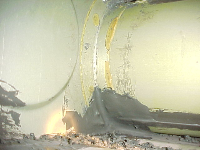 Picture of inside of tank, aft of spar, showing old sealant scrapings