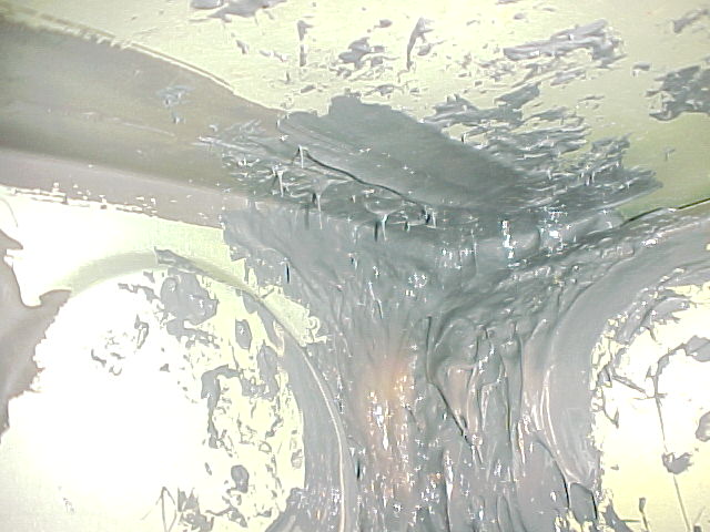 Picture of inside of tank, top/aft of spar, with new sealant applied